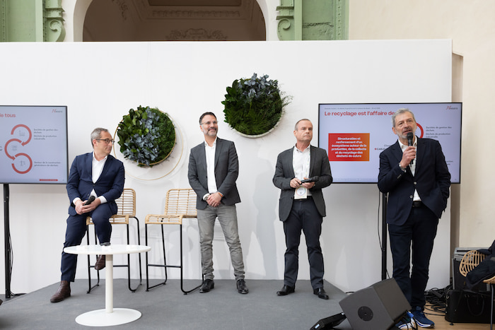 Conference at the ChangeNOW event, with four speakers discussing on stage.