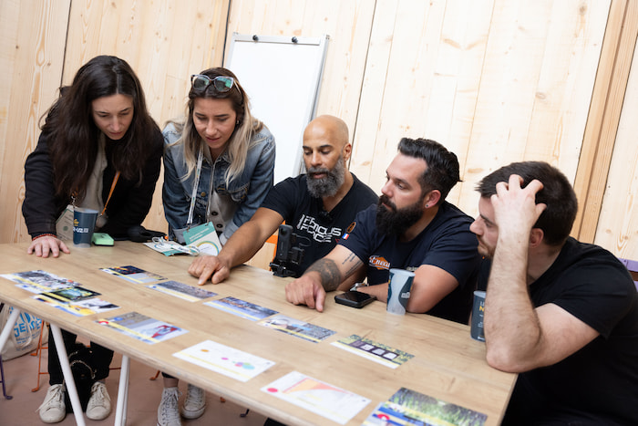 A group of five exchanging ideas at the ChangeNow event.